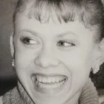 Smiling portrait of Oksana Baiul, 1994 Olympic figure skating champion (Wikimedia Commons photo, CC BY-SA 4.0)